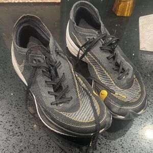 Nike VaporFly Bkack and Gold Athletic Shoes